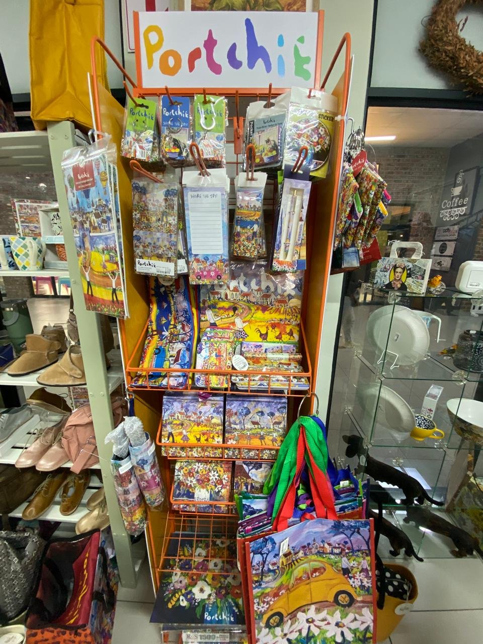 The Portchie stand hung with bags, puzzles, umbrellas and notebooks